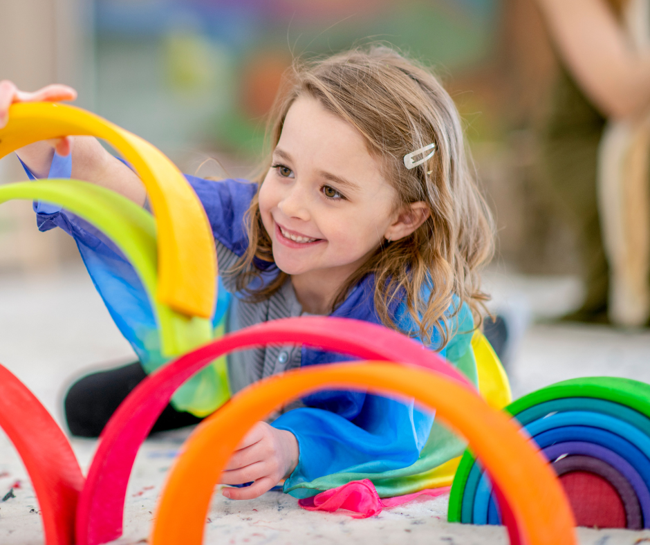 Kid with ADHD playing with multicolored toys