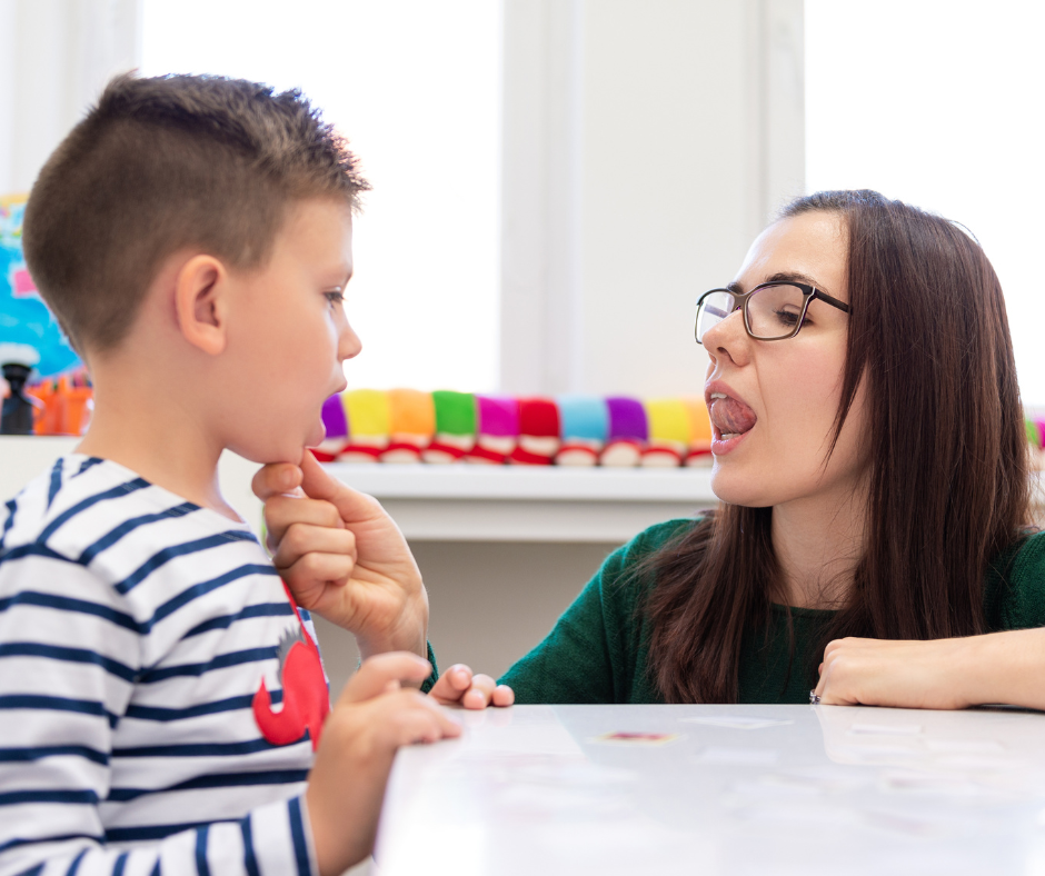 Kid with autism doing speech therapy with a therapist