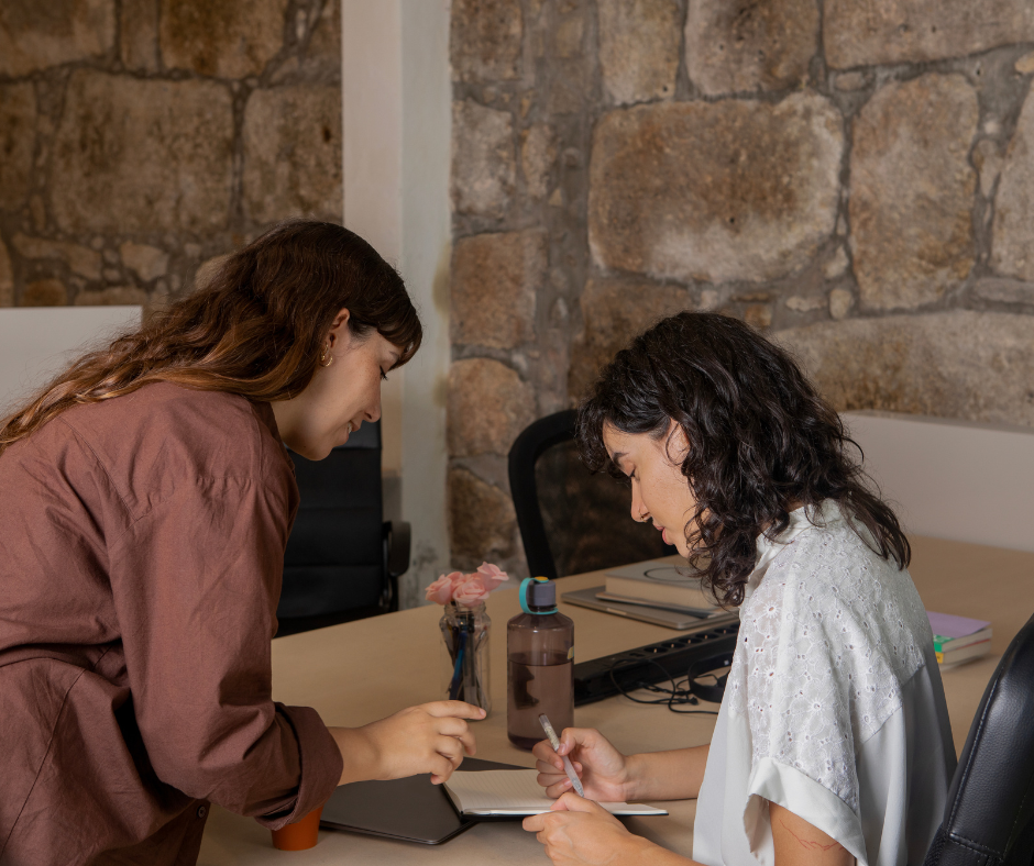 Mother and daughter with autism writing in journal