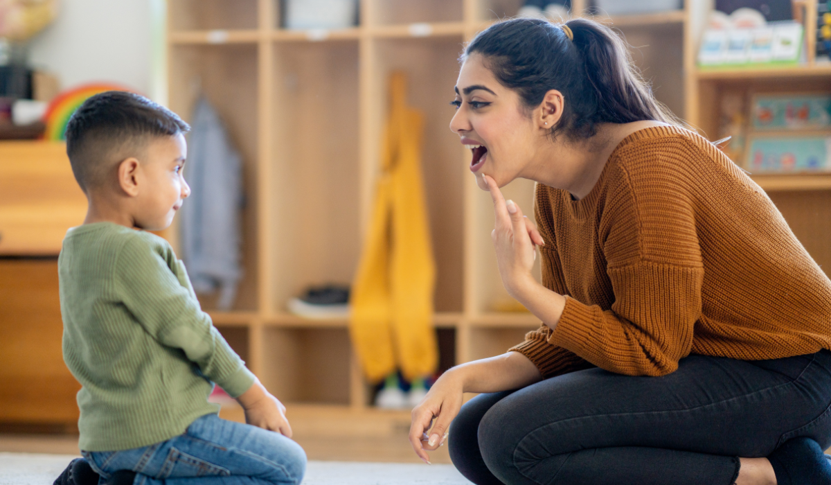 Teacher using ABA therapy techniques with a child