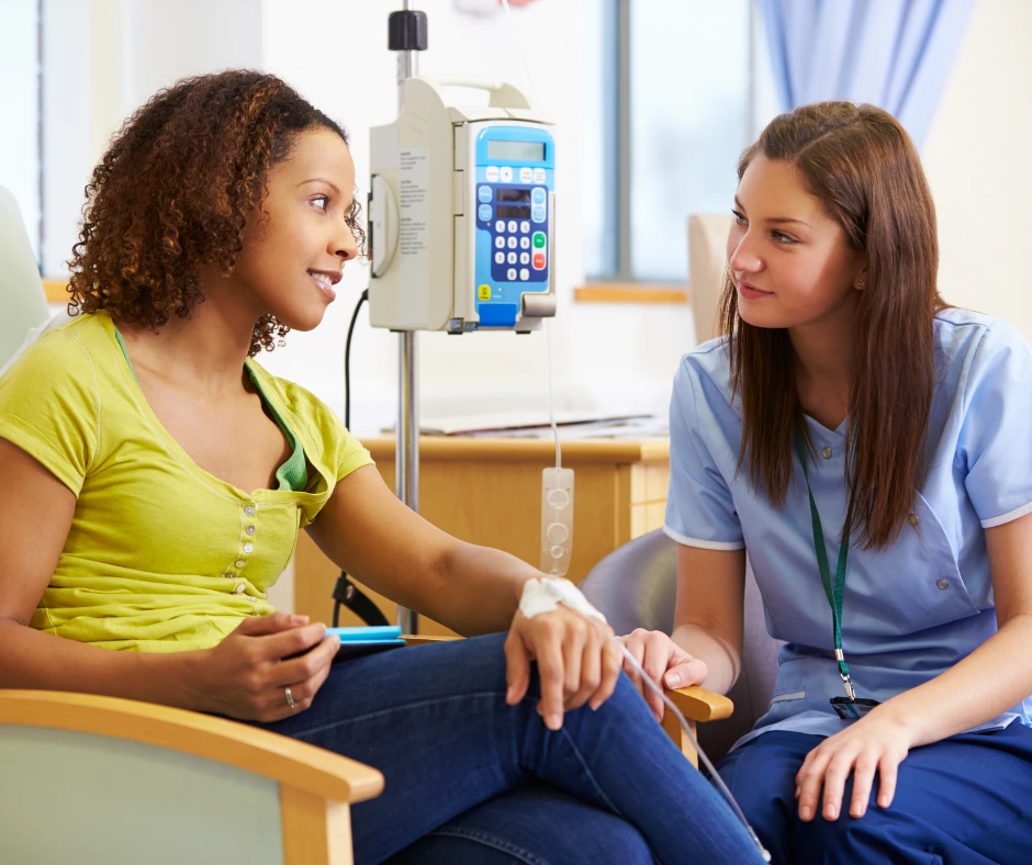 Caregiver taking vital signs from a patient
