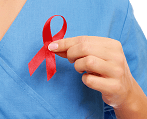 A caretaker holds a small red ribbon
