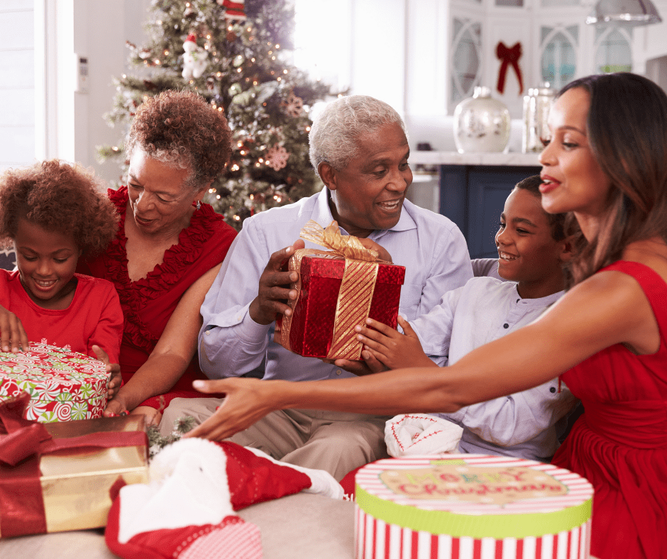 A family opening gifts together for Christmas