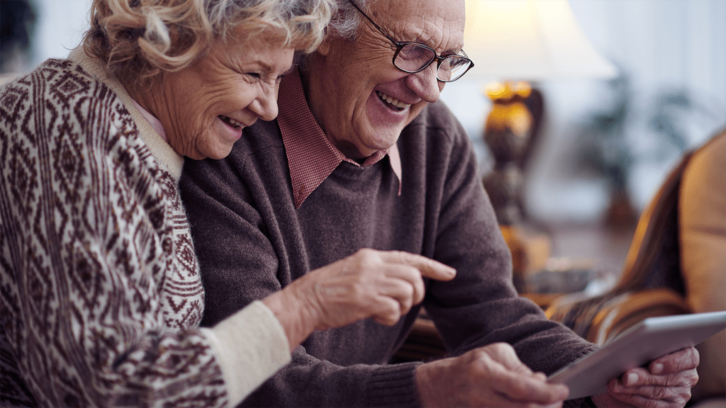 Grandparents using technology together