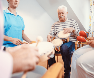 Group of seniors playing music with different instruments