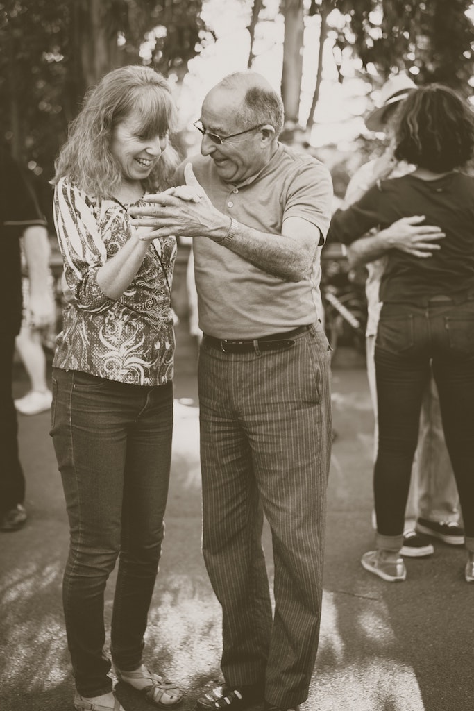 Two seniors dancing together