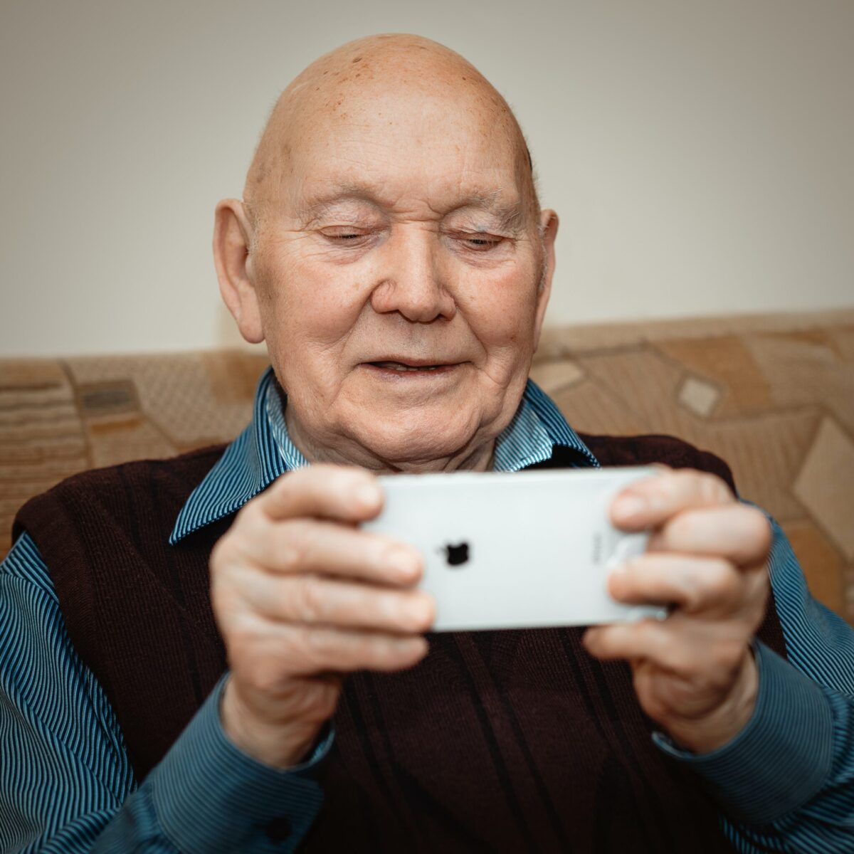 A senior man using a phone