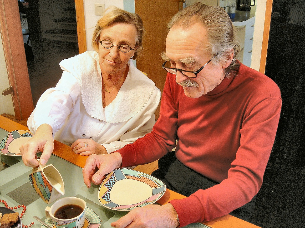 An elderly couple enjoying breakfast