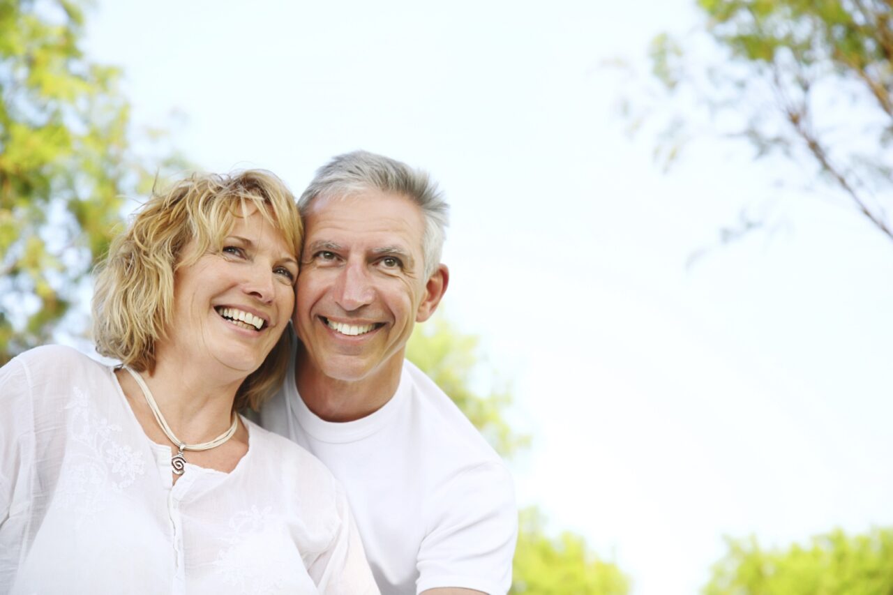 A man and his wife smiling excitedly