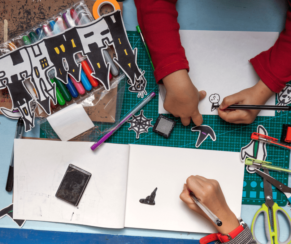 Children creating arts and crafts for Halloween.