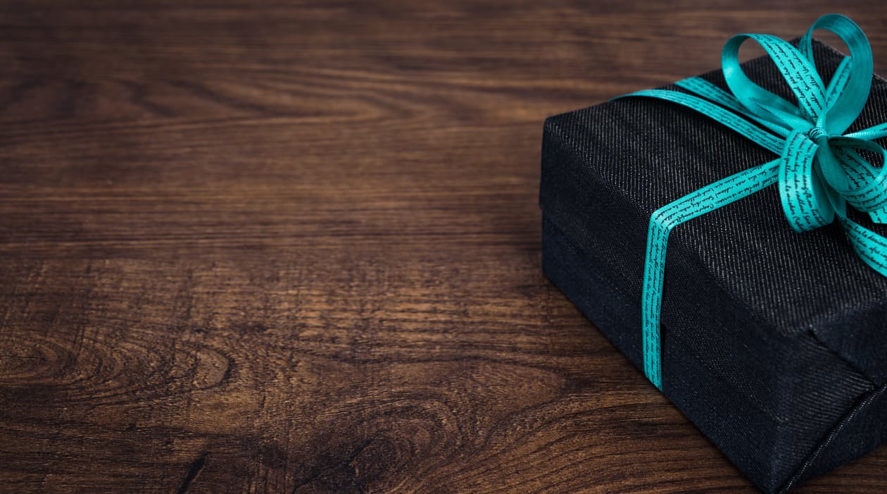 A denim box with a blue bow on top