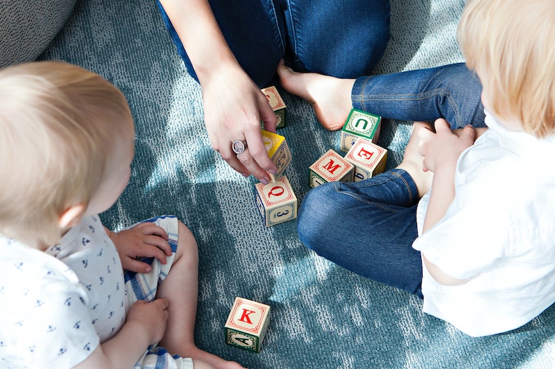 A family plays with blocks together