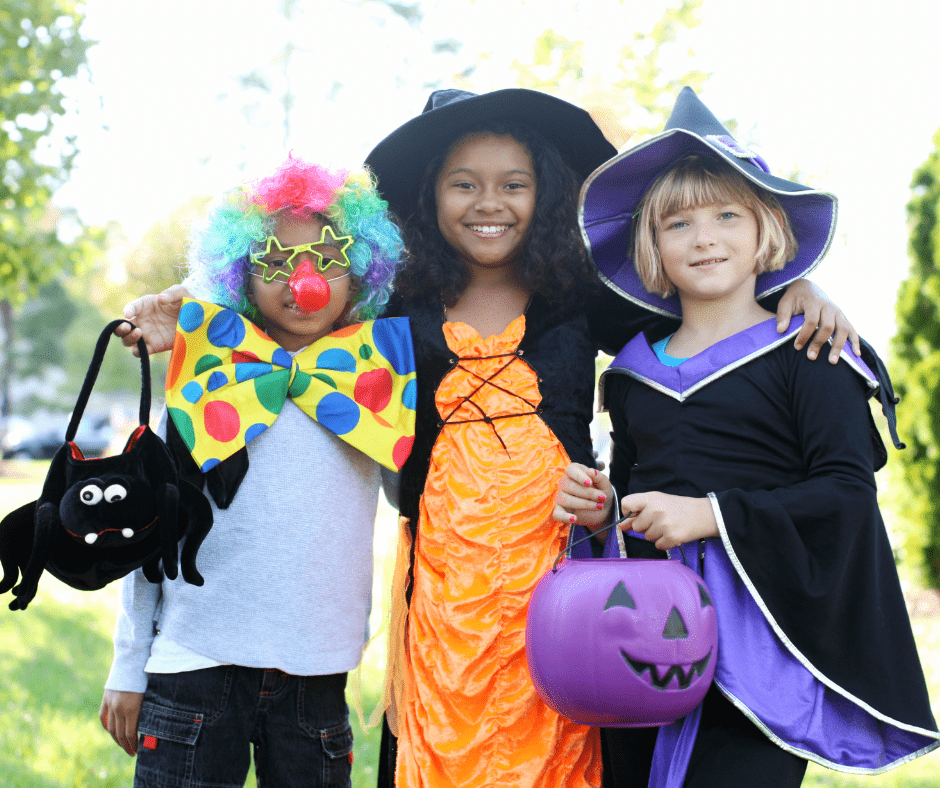 Three kids wearing their Halloween costumes