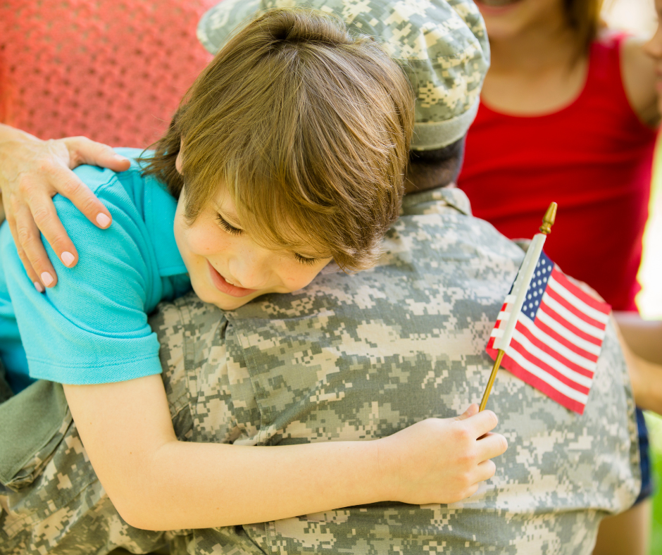 child embracing veteran father