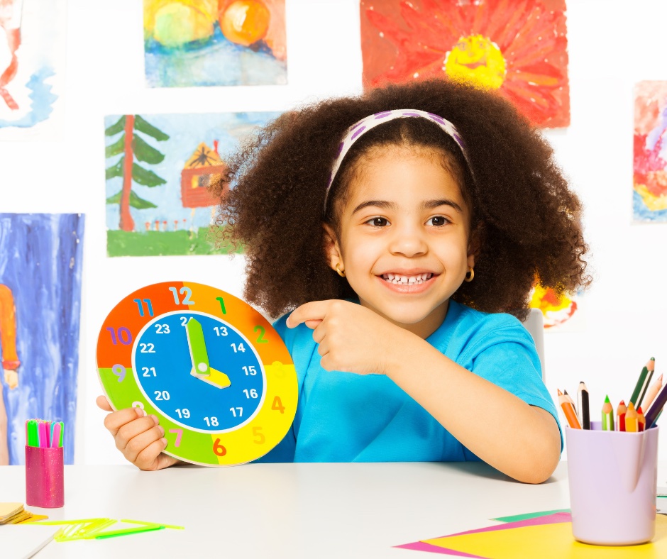 Young child holding clock to symbolize time change.