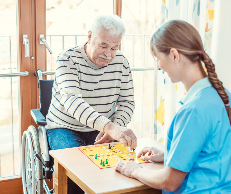 Young caregiver interacting with elderly patient